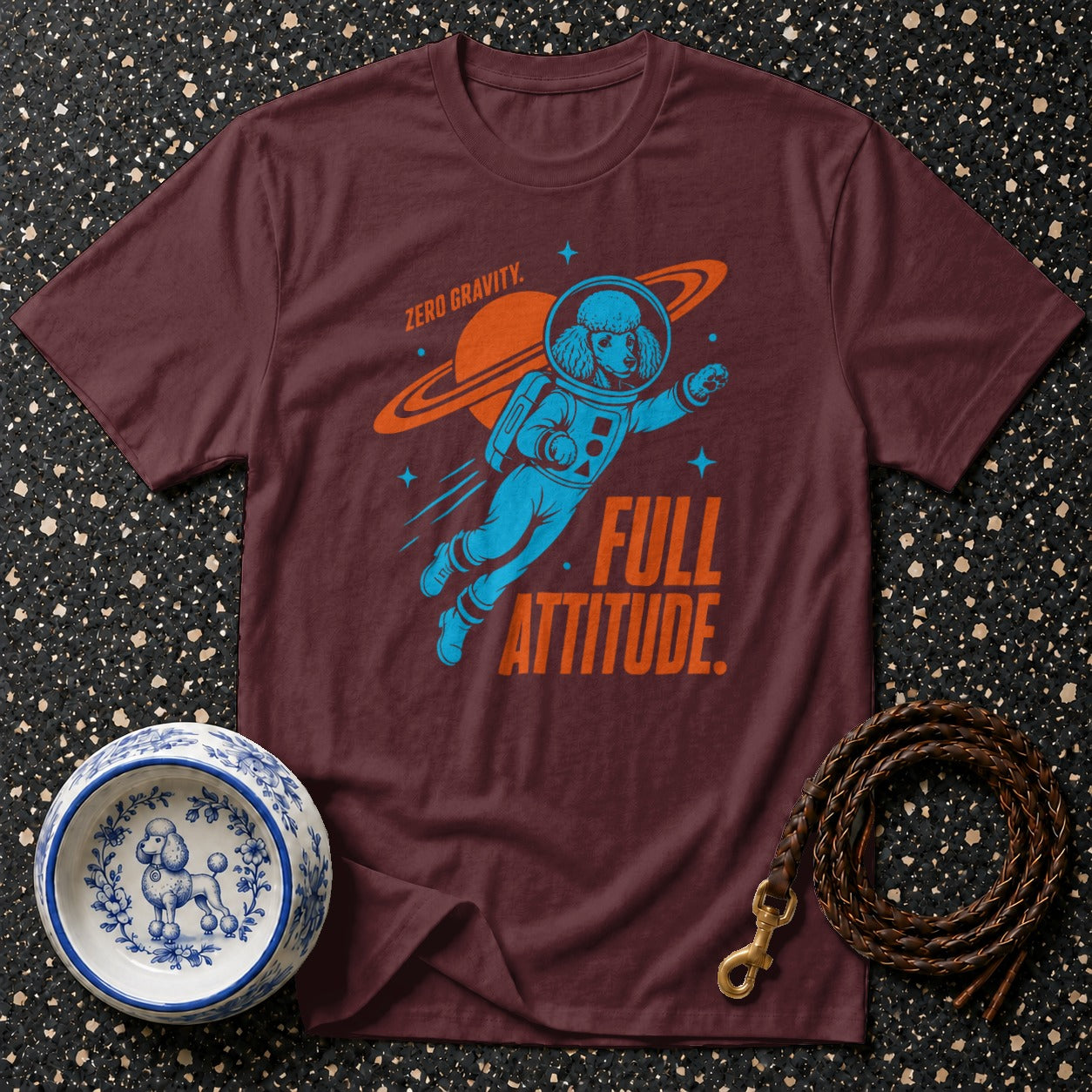 Burgundy t-shirt with poodle astronaut graphic and text "Zero Gravity. Full Attitude."