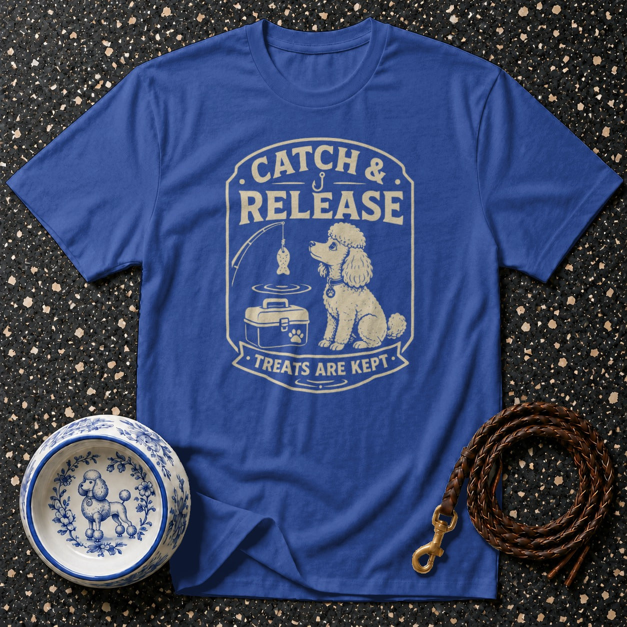 Blue t-shirt with "Catch & Release Treats Are Kept" graphic depicting a poodle.