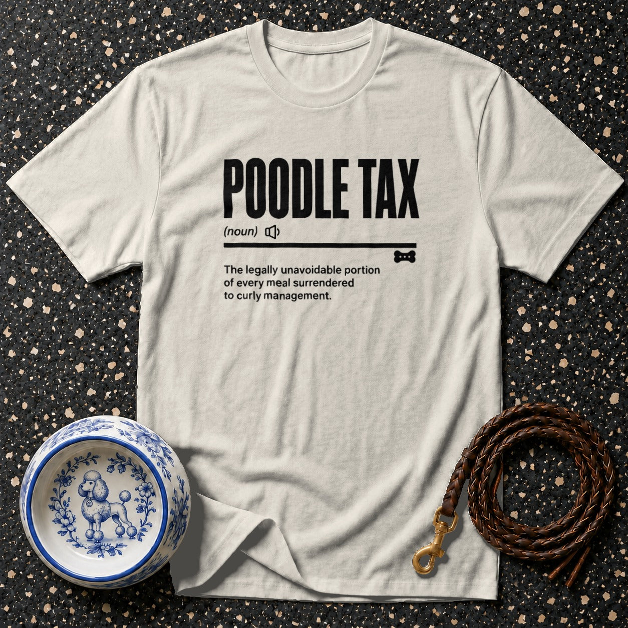 T-shirt with "POODLE TAX (noun) The legally unavoidable portion of every meal surrendered to curly management."