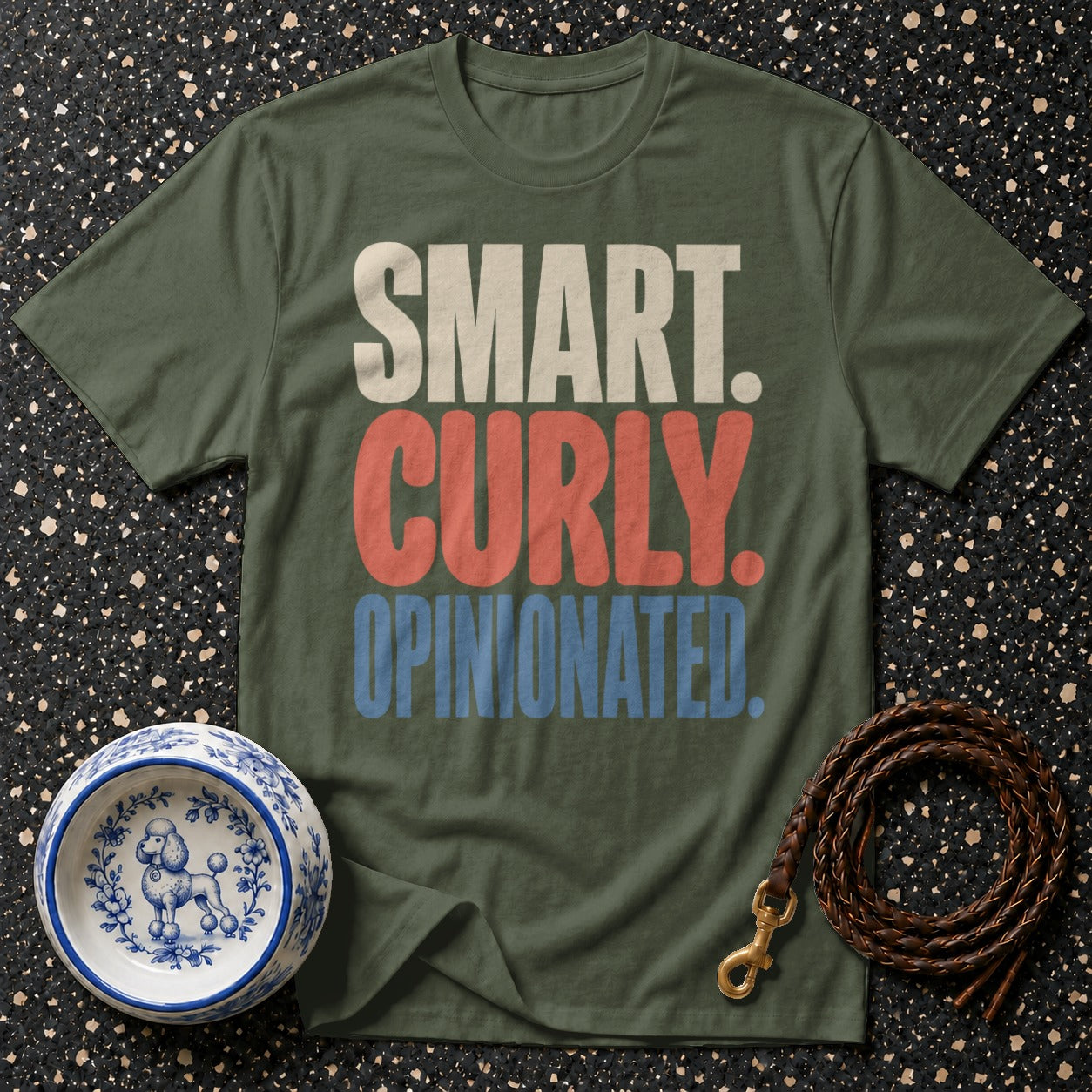 Green t-shirt with "SMART. CURLY. OPINIONATED." text, dog bowl, and leash.