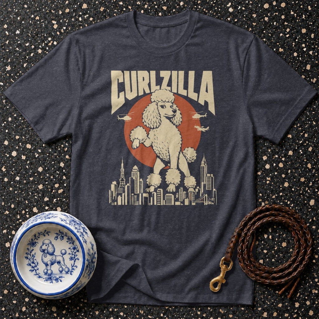 T-shirt with "CURLZILLA" text, poodle on cityscape, with dog bowl and leash.