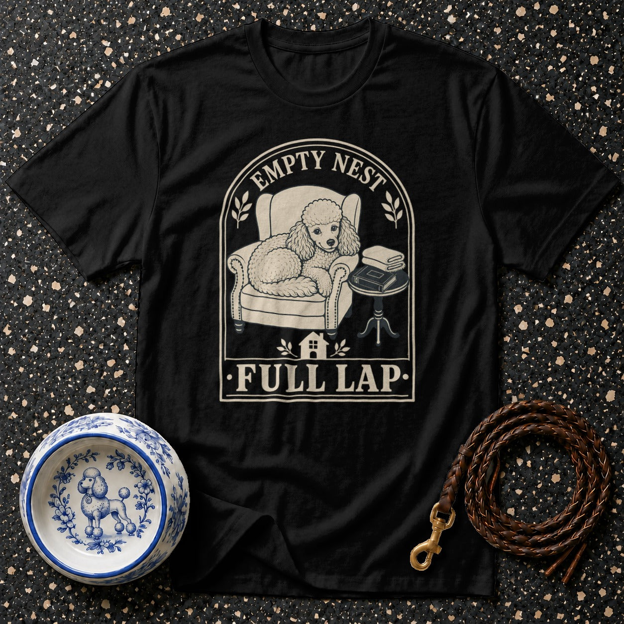 Black t-shirt with poodle graphic and text "EMPTY NEST FULL LAP".