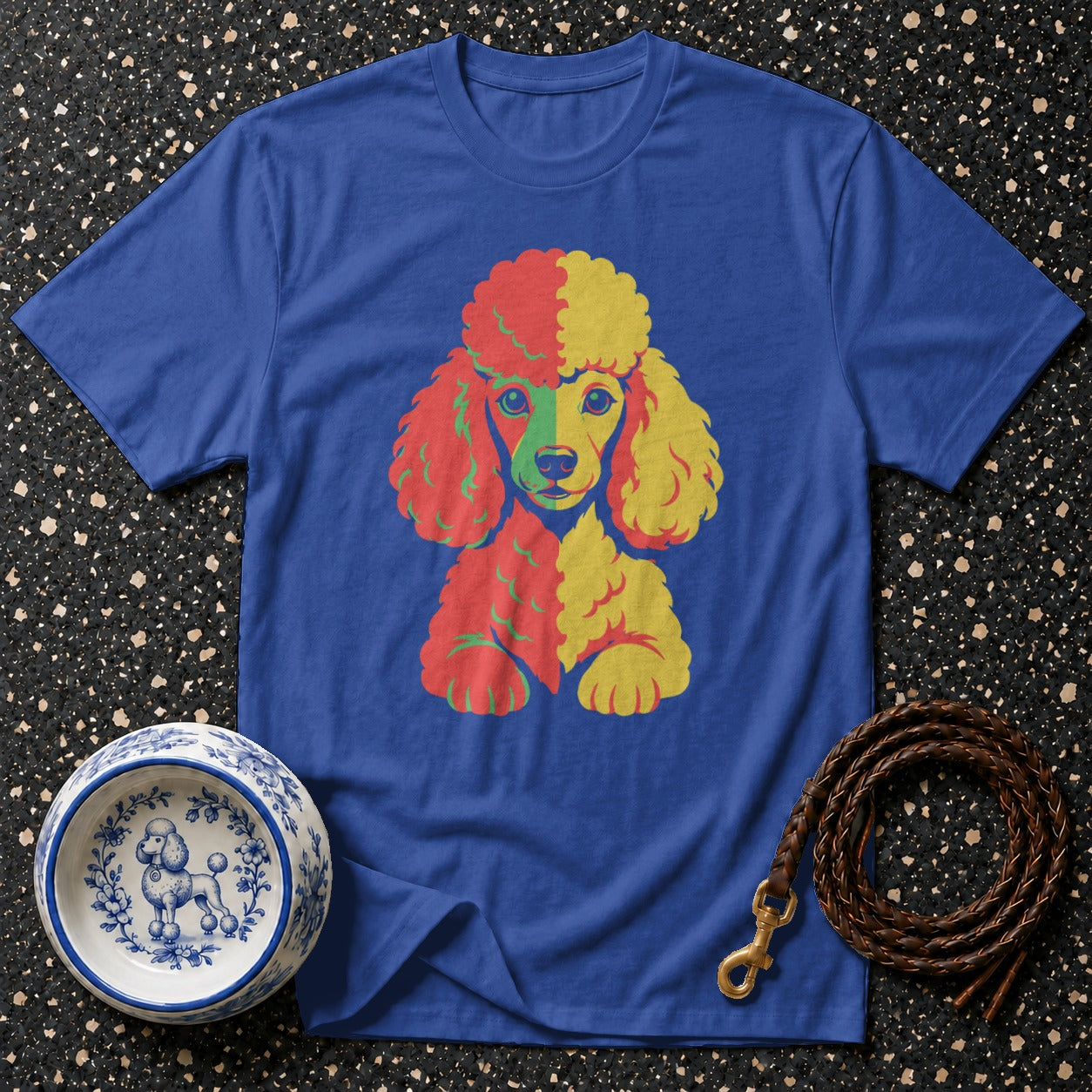 Blue t-shirt with colorful poodle graphic, dog bowl, and leather leash.
