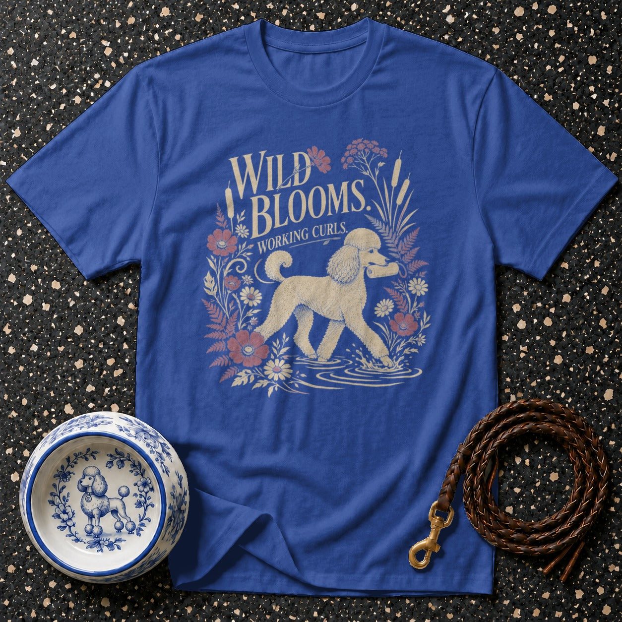 Blue t-shirt with "Wild Blooms Working Curls" text and poodle illustration.