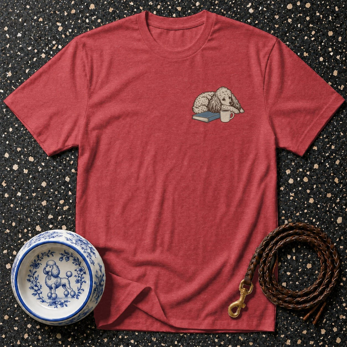 Red t-shirt with embroidered dog on book and coffee cup.