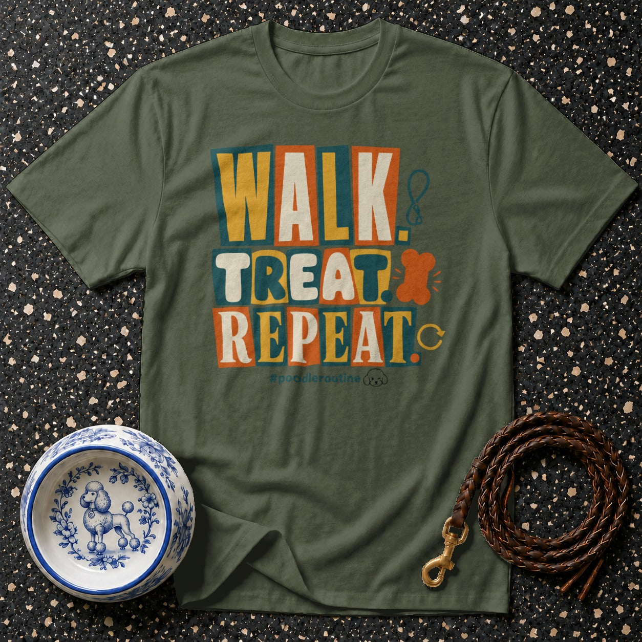 Green t-shirt with "WALK TREAT REPEAT" text and poodle accessories.
