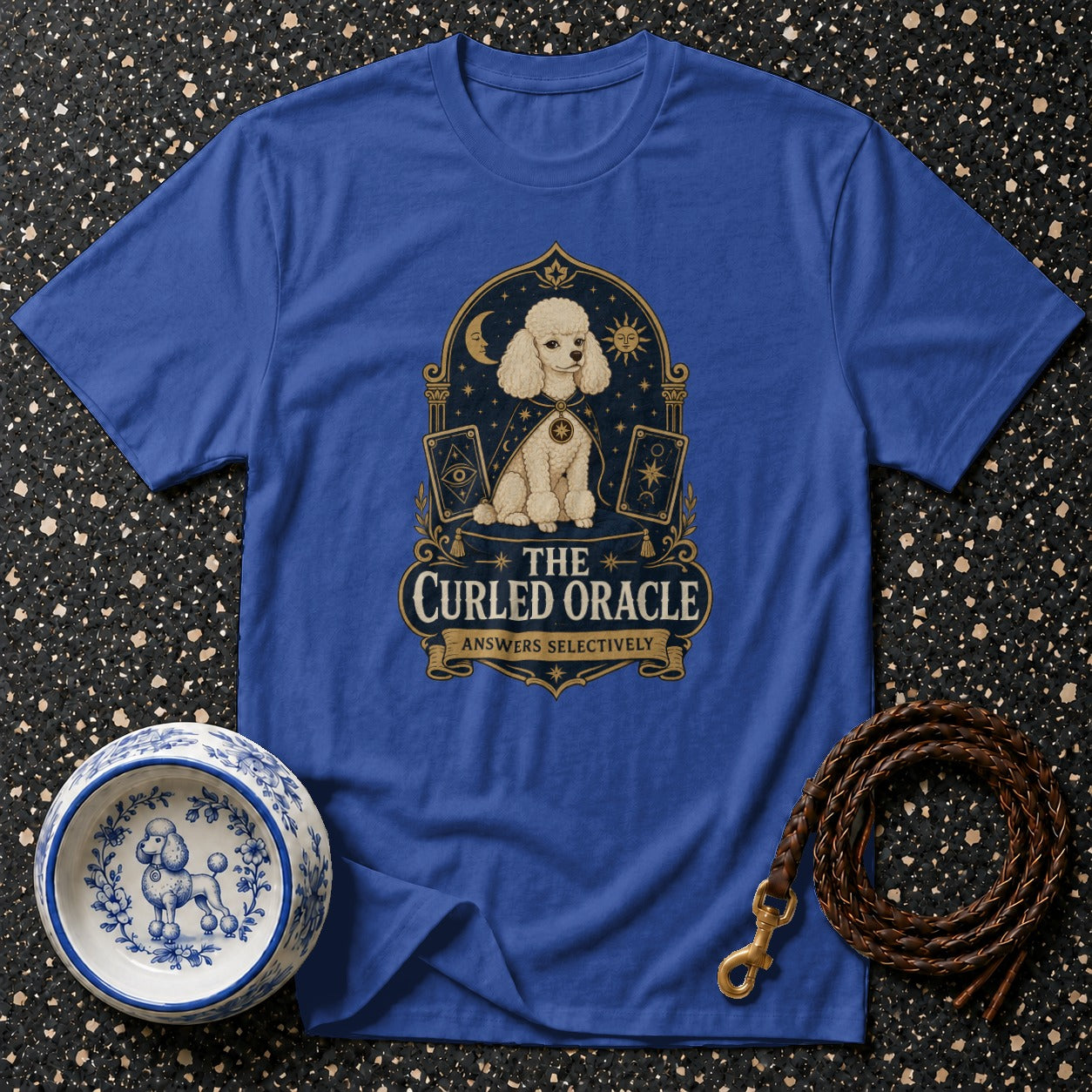 Blue t-shirt with poodle oracle design and "The Curled Oracle Answers Selectively" text.