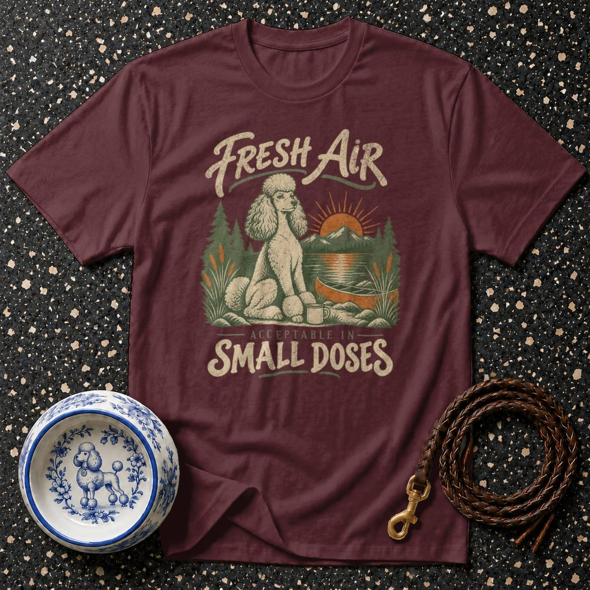 Maroon t-shirt with poodle, canoe, and mountains graphic: "Fresh Air Acceptable In Small Doses."