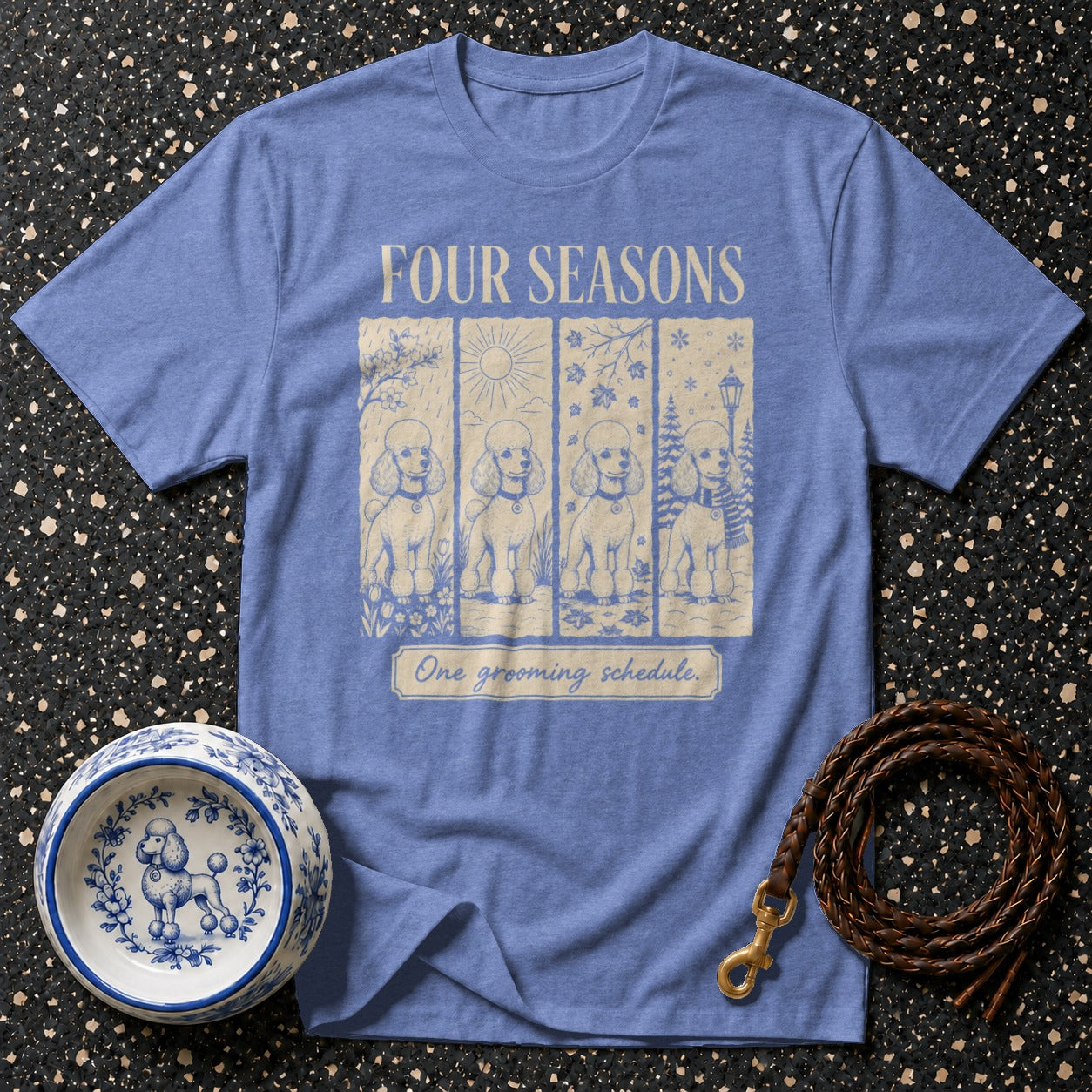 Blue t-shirt with "Four Seasons" and four poodles in different weather.