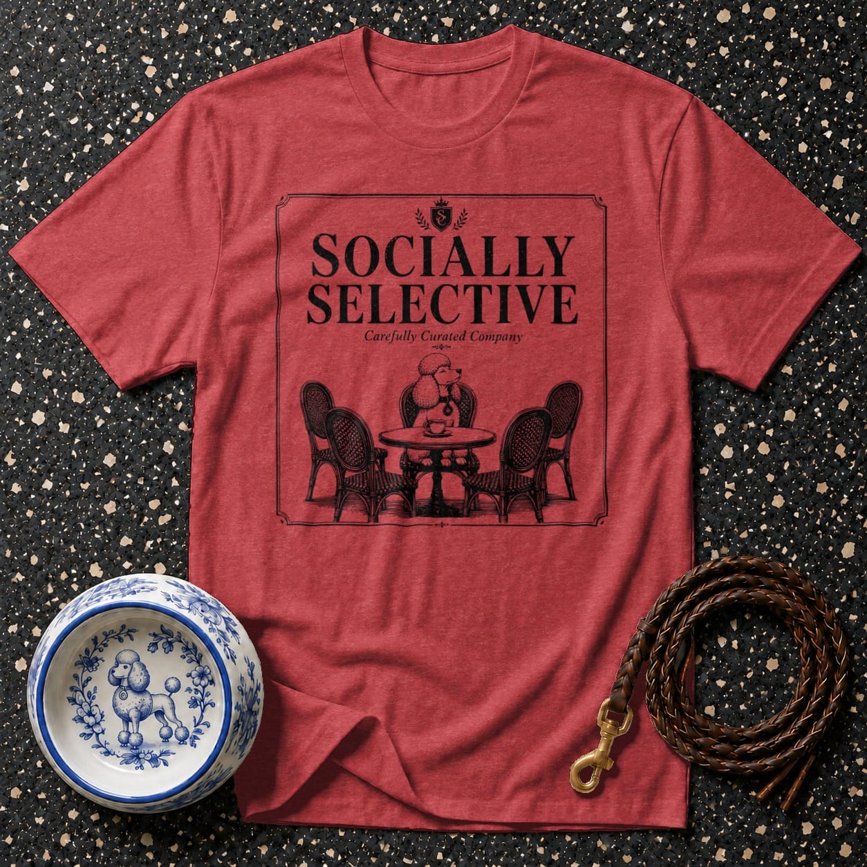 Red t-shirt with "Socially Selective" graphic and poodle at a table.