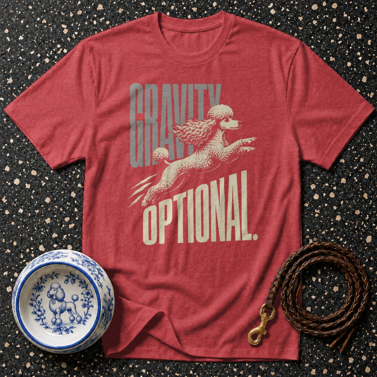 Red t-shirt with white poodle graphic and "GRAVITY OPTIONAL" text.