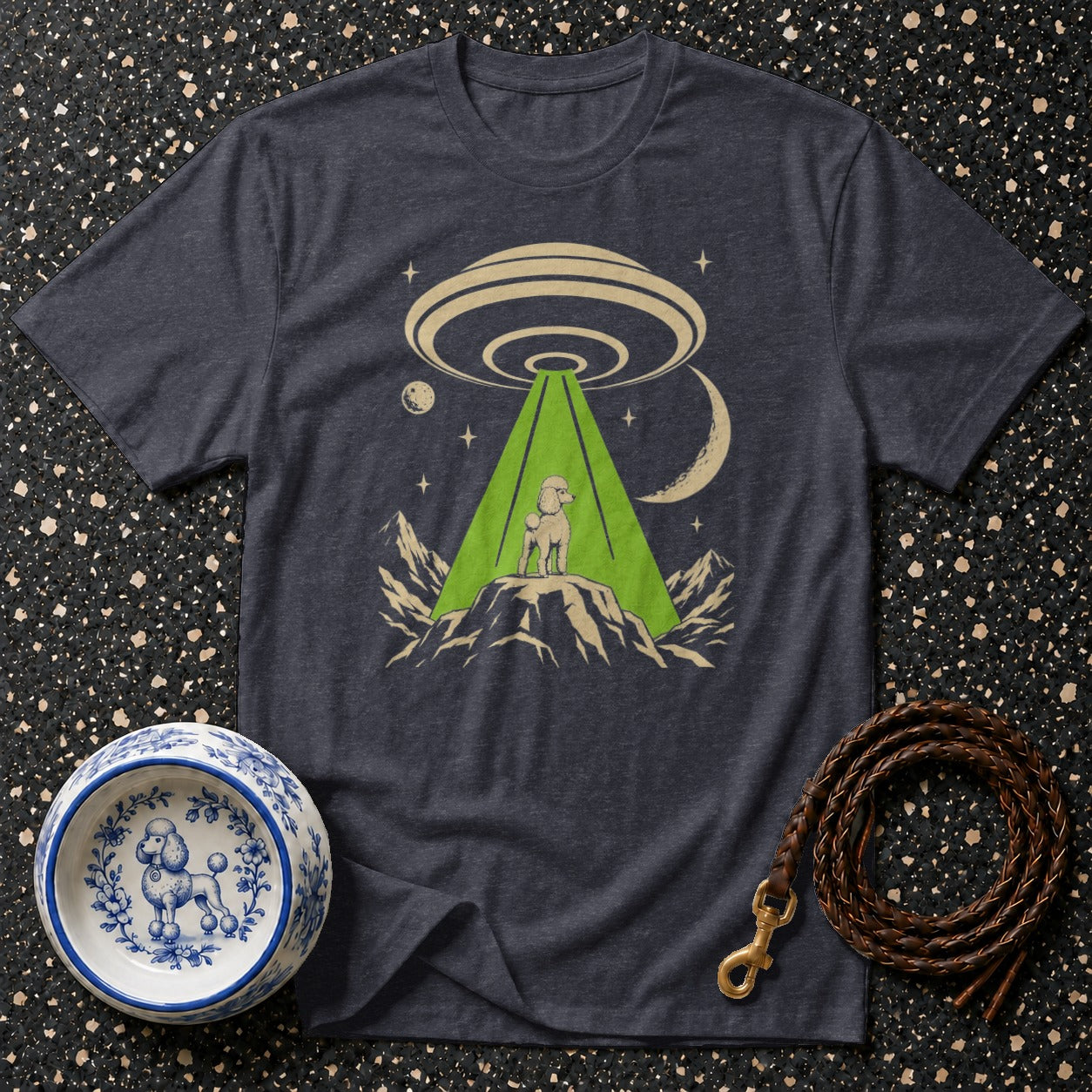 Dark grey t-shirt with a poodle abducted by a UFO graphic.