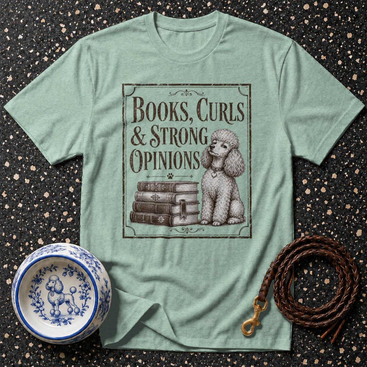 Light green t-shirt with "Books, Curls & Strong Opinions" text and a poodle illustration.