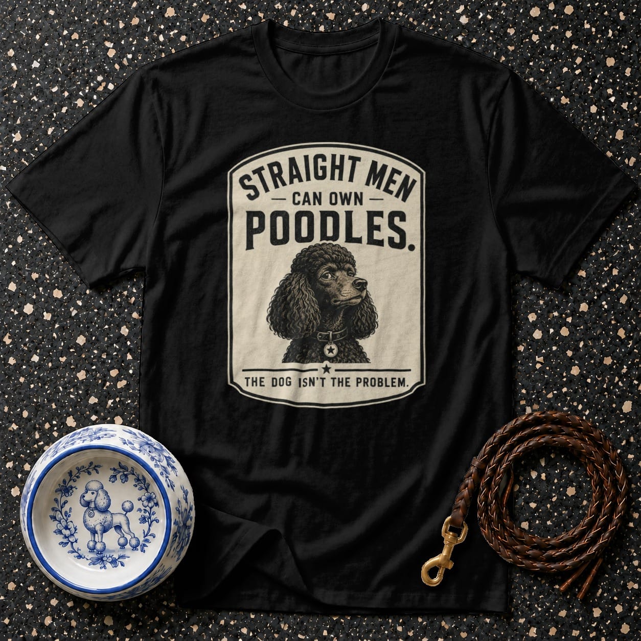 Black t-shirt with poodle graphic and text reading "Straight men can own poodles. The dog isn't the problem."