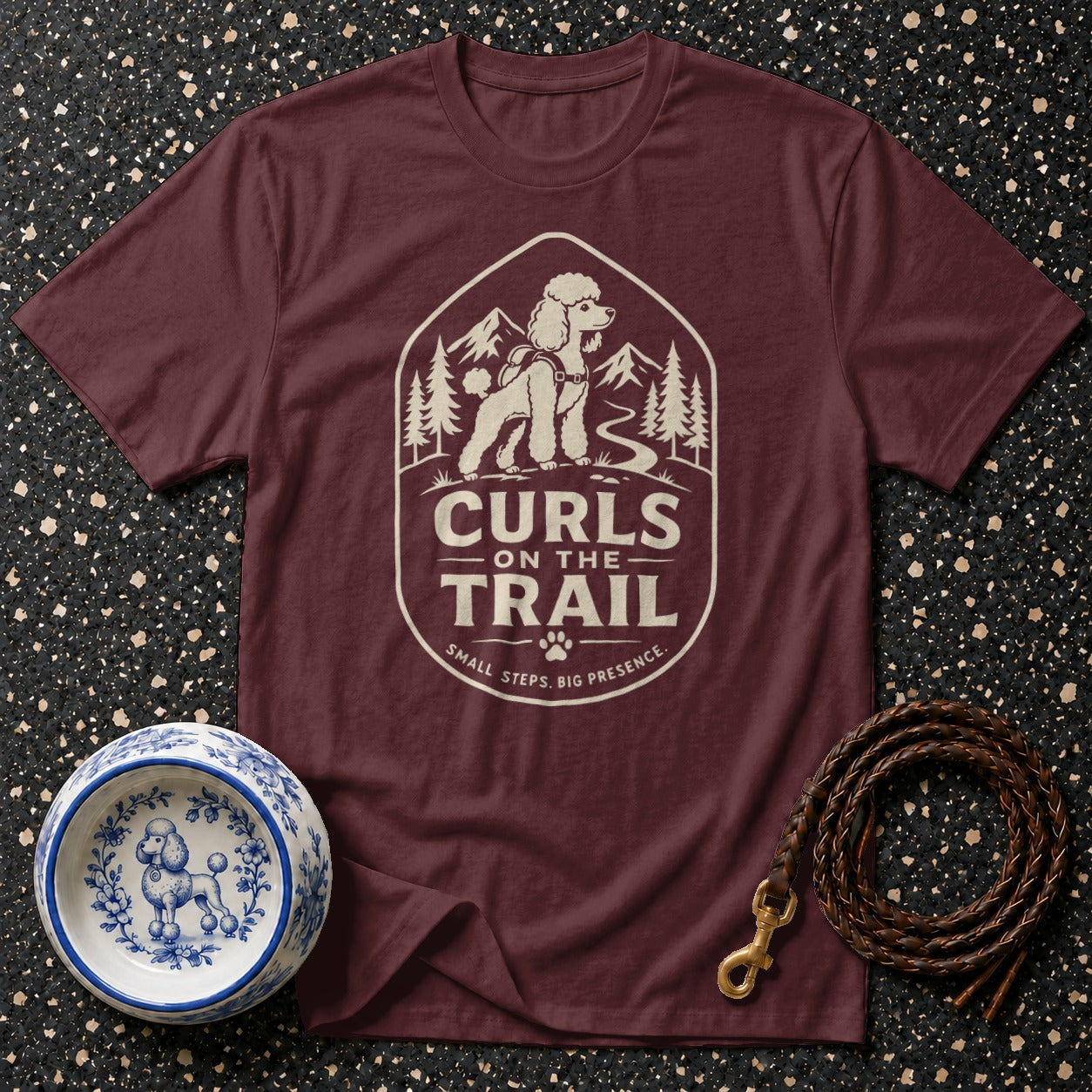 Maroon t-shirt with "Curls on the Trail" graphic featuring a poodle on a mountain path