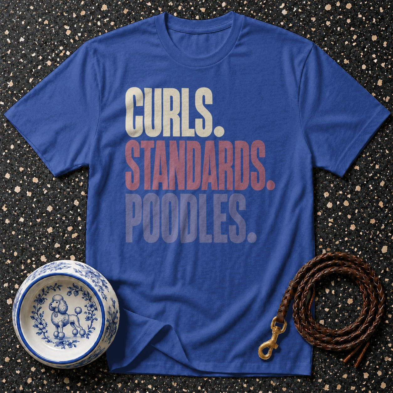 Blue t-shirt with text "Curls. Standards. Poodles." with a dog bowl and leash.