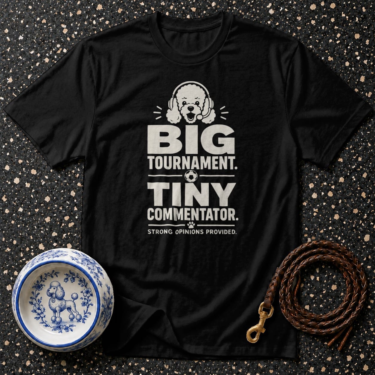 Black t-shirt with "BIG TOURNAMENT. TINY COMMENTATOR. STRONG OPINIONS PROVIDED." text and poodle graphic