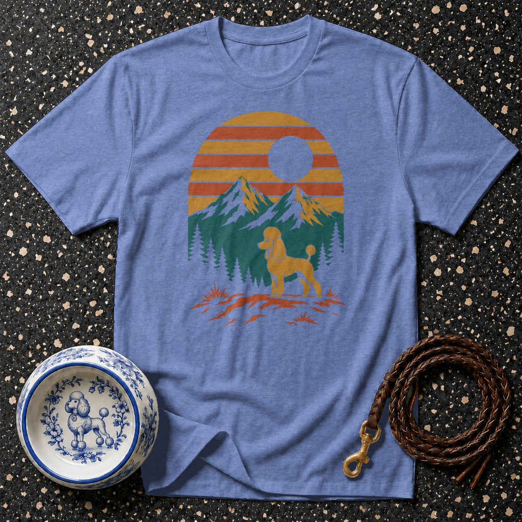 Blue t-shirt with a poodle silhouette against a sunset mountain landscape.