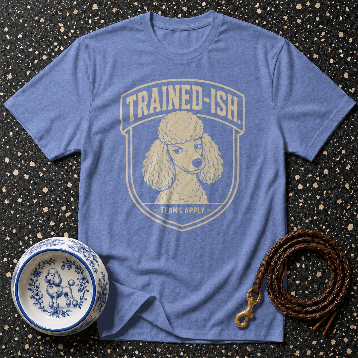 Blue t-shirt with poodle graphic and "TRAINED-ISH TERMS APPLY" text.