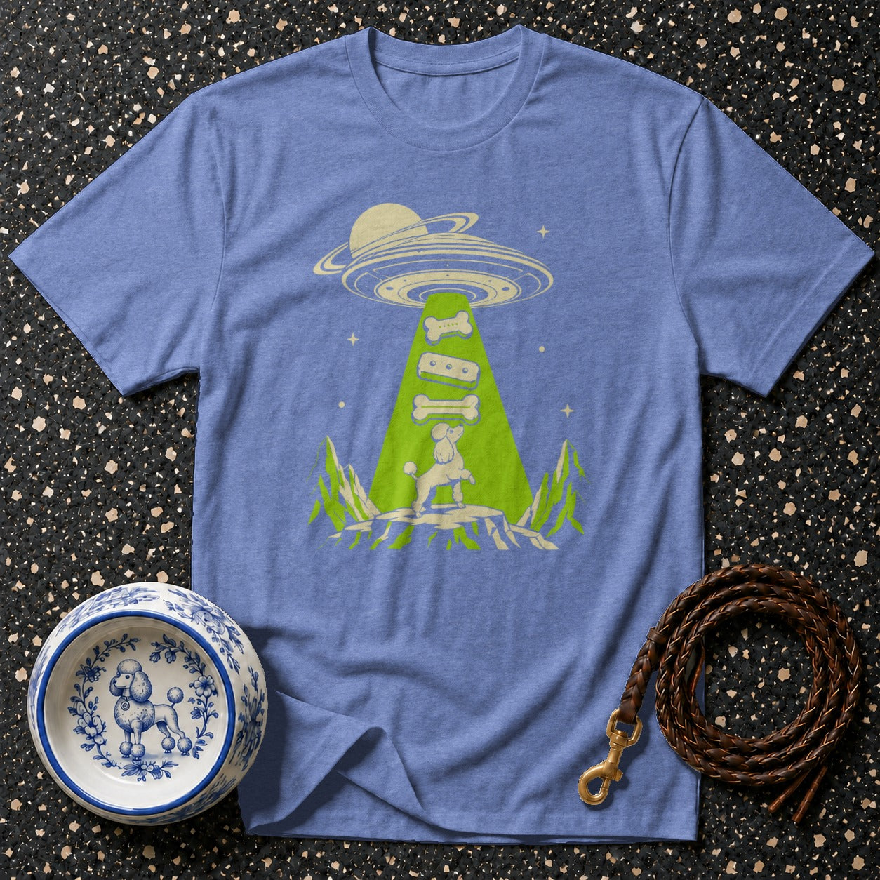 T-shirt with a poodle being abducted by a UFO, collecting dog bones.