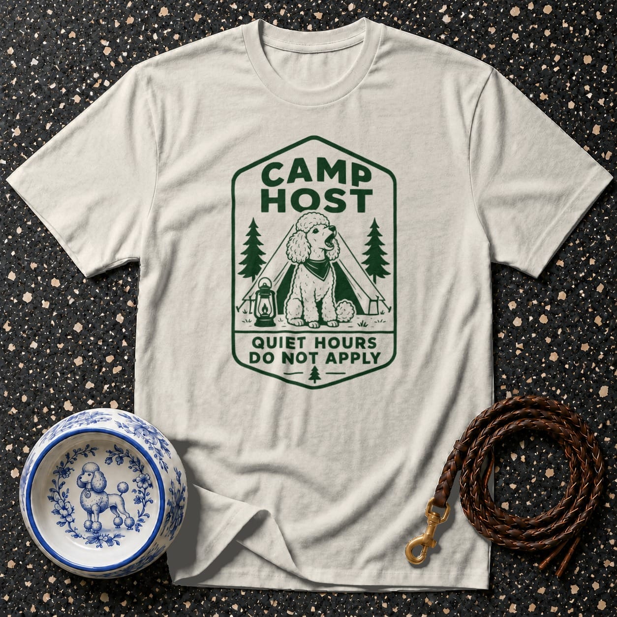 T-shirt graphic of a poodle in a tent with text "CAMP HOST QUIET HOURS DO NOT APPLY".