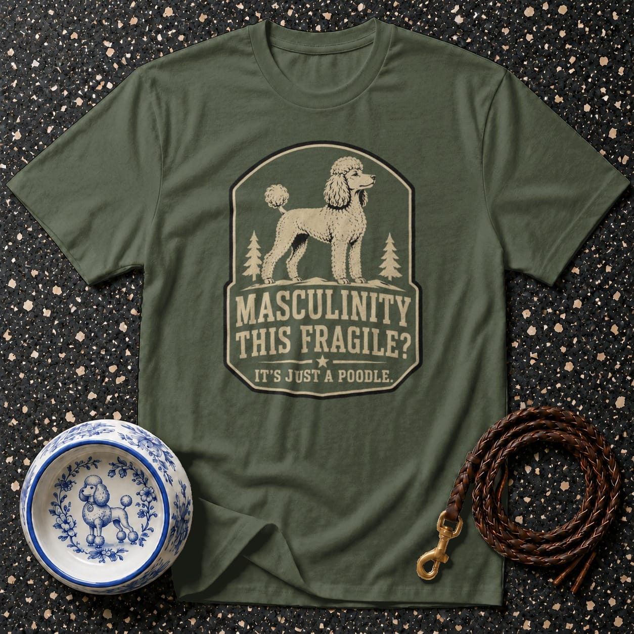 Green t-shirt with poodle graphic and text: "MASCULINITY THIS FRAGILE? IT'S JUST A POODLE."