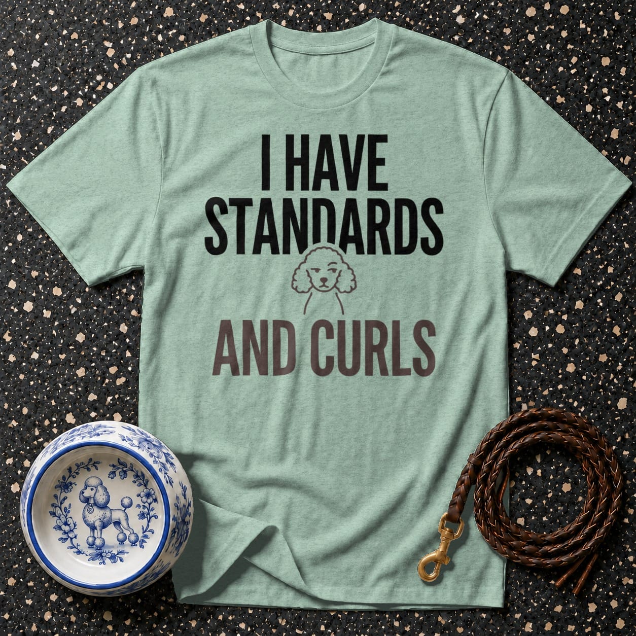 Light aqua t-shirt with graphic text "I HAVE STANDARDS AND CURLS" and poodle illustration.