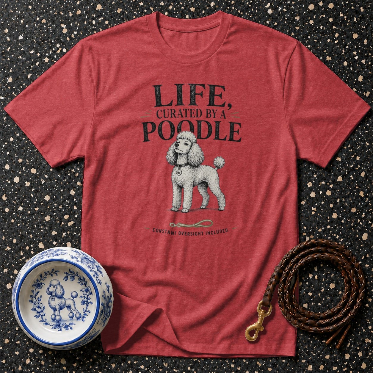 Red t-shirt with "LIFE, CURATED BY A POODLE" text and poodle graphic.