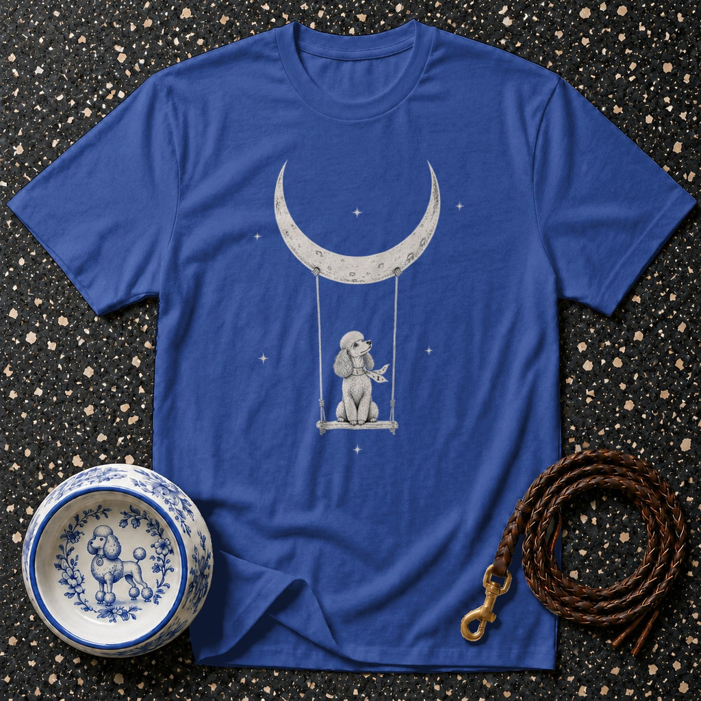 Blue t-shirt with a drawing of a poodle on a swing under a crescent moon.