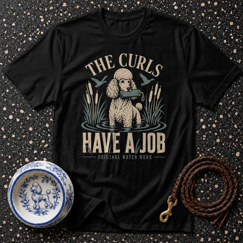 Black t-shirt with a poodle retrieving in water, text "The Curls Have A Job".