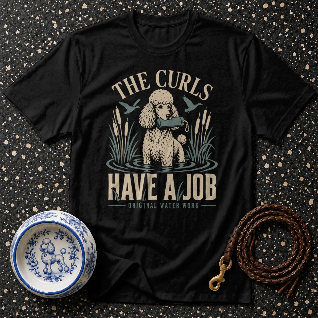 Black t-shirt with a poodle retrieving in water, text "The Curls Have A Job".