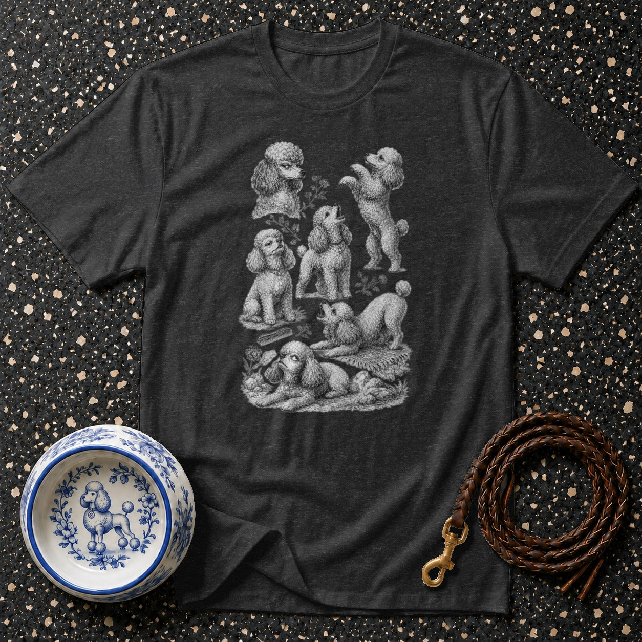 Dark grey t-shirt with a vintage-style print of poodles in various poses.