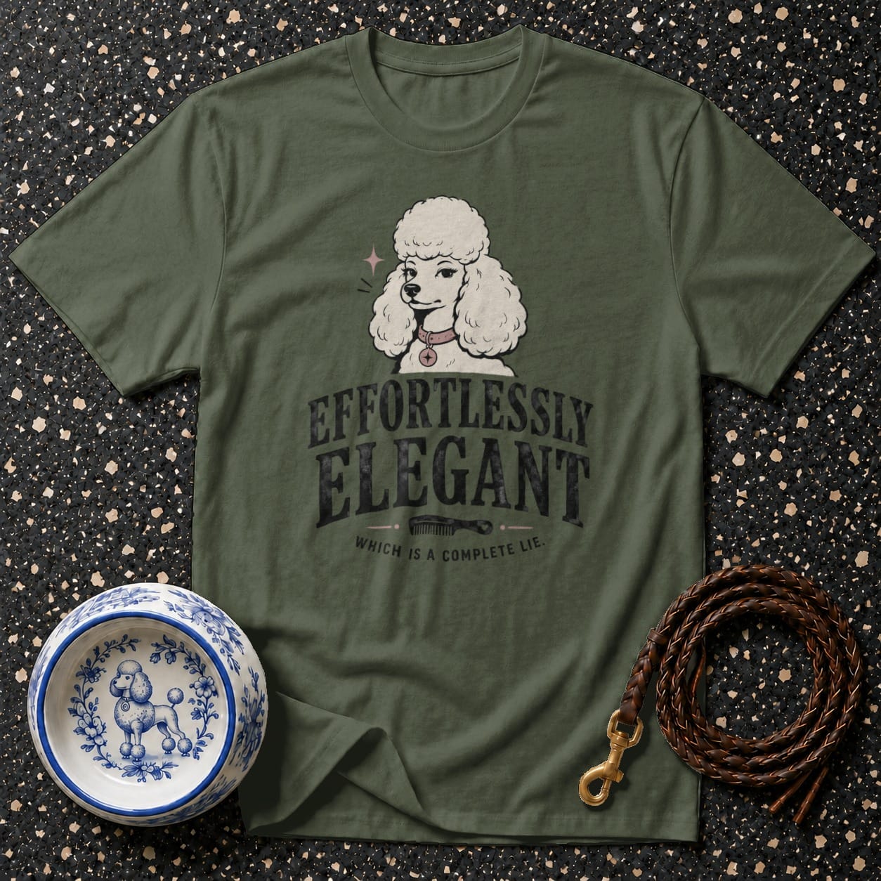 Green t-shirt with poodle graphic and text "Effortlessly Elegant Which is a complete lie."