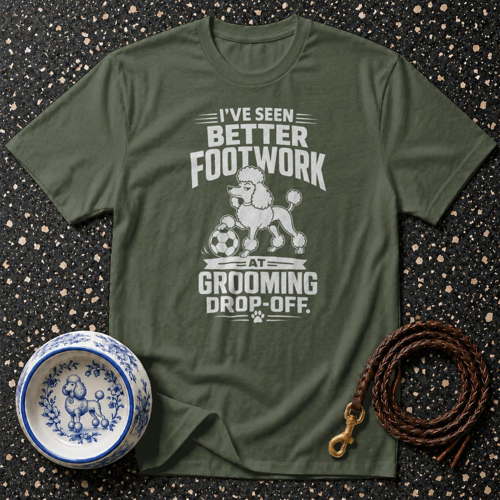 Green t-shirt with white graphic: "I've Seen Better Footwork At Grooming Drop-Off."