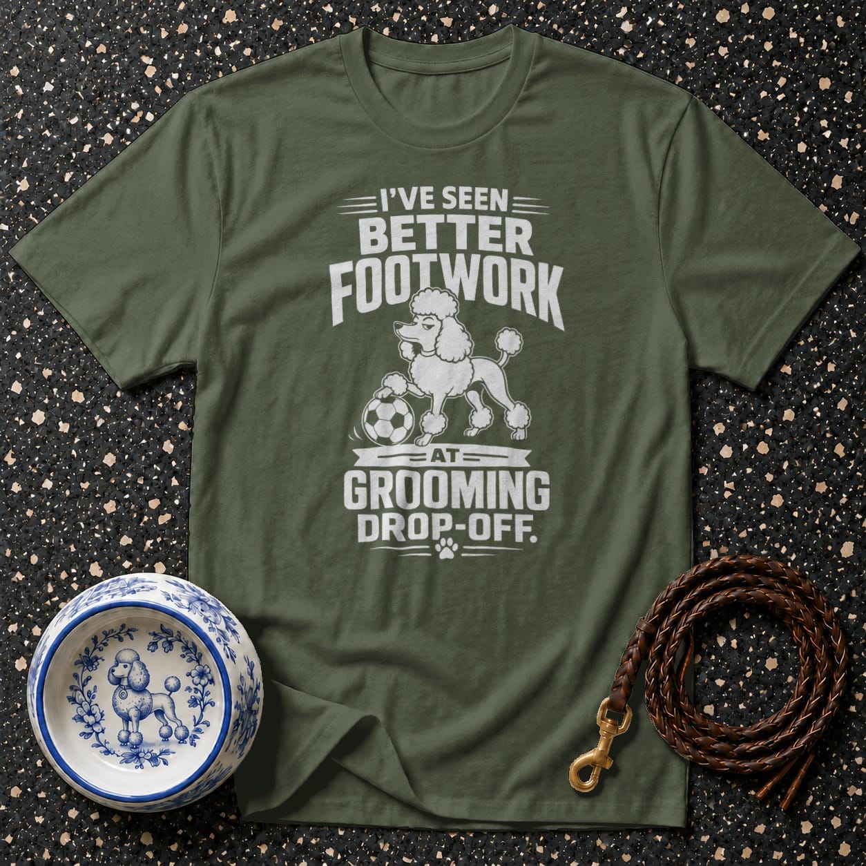 Green t-shirt with white graphic: "I've Seen Better Footwork At Grooming Drop-Off."