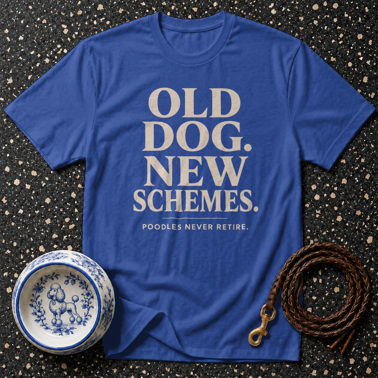 Blue t-shirt with "OLD DOG. NEW SCHEMES. POODLES NEVER RETIRE." text.