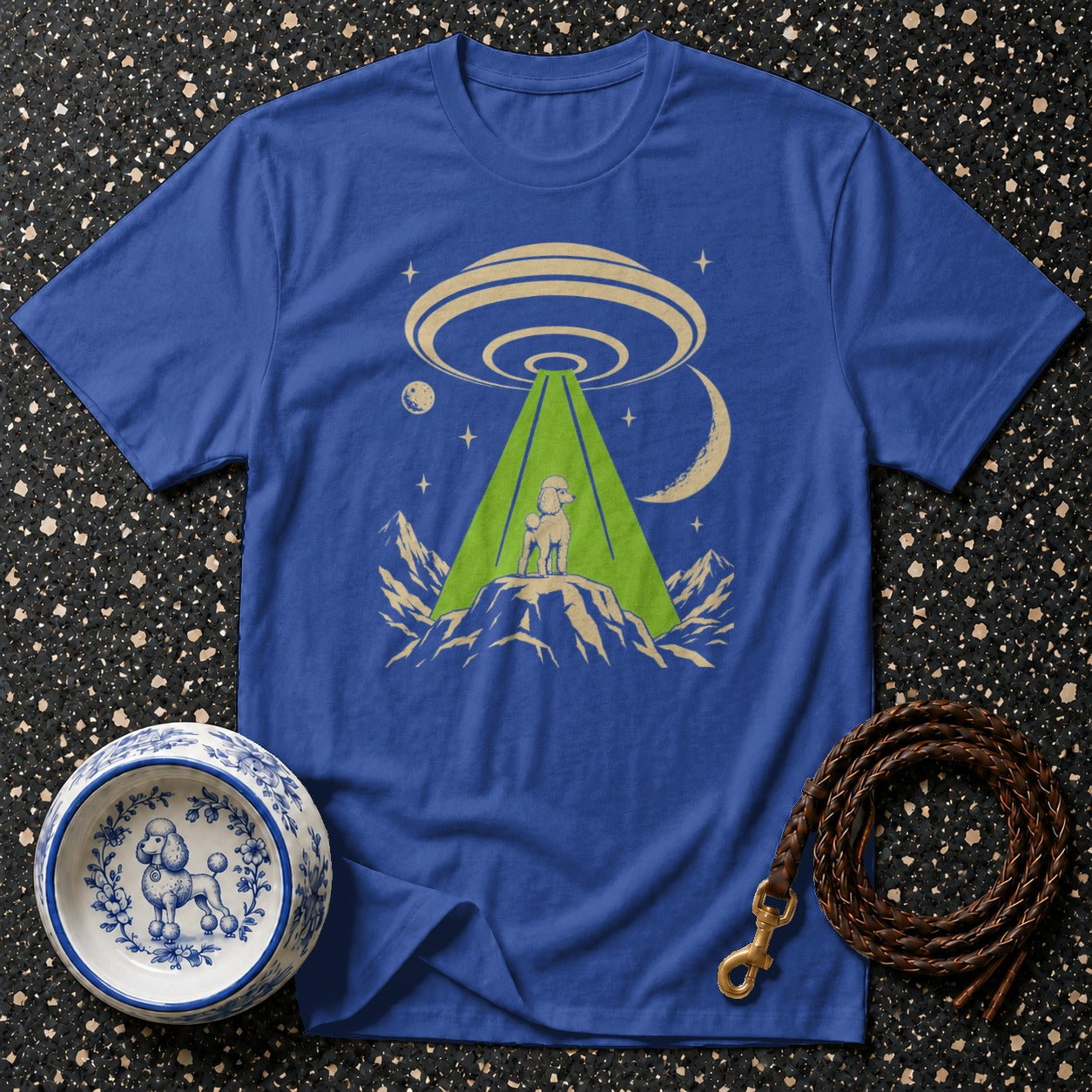 Blue t-shirt with poodle in UFO abduction beam graphic.