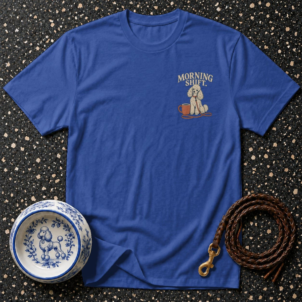 Blue t-shirt with embroidered poodle, coffee cup, and text "MORNING SHIFT.".
