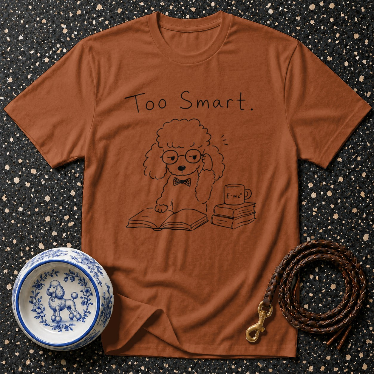 Brown t-shirt with a poodle graphic reading "Too Smart", books, and a coffee cup.