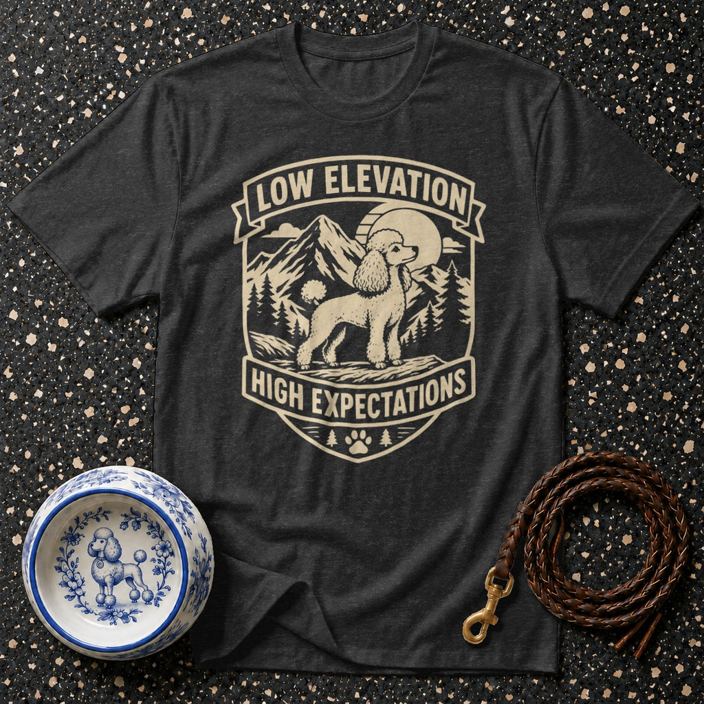Dark grey t-shirt with a poodle and mountain graphic that says "Low Elevation High Expectations".