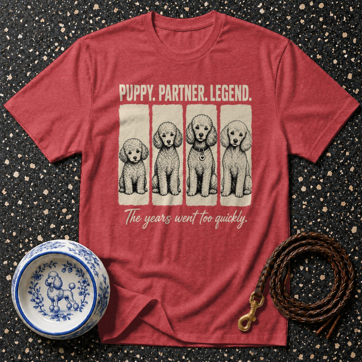 Red t-shirt with four poodles and text "PUPPY. PARTNER. LEGEND."