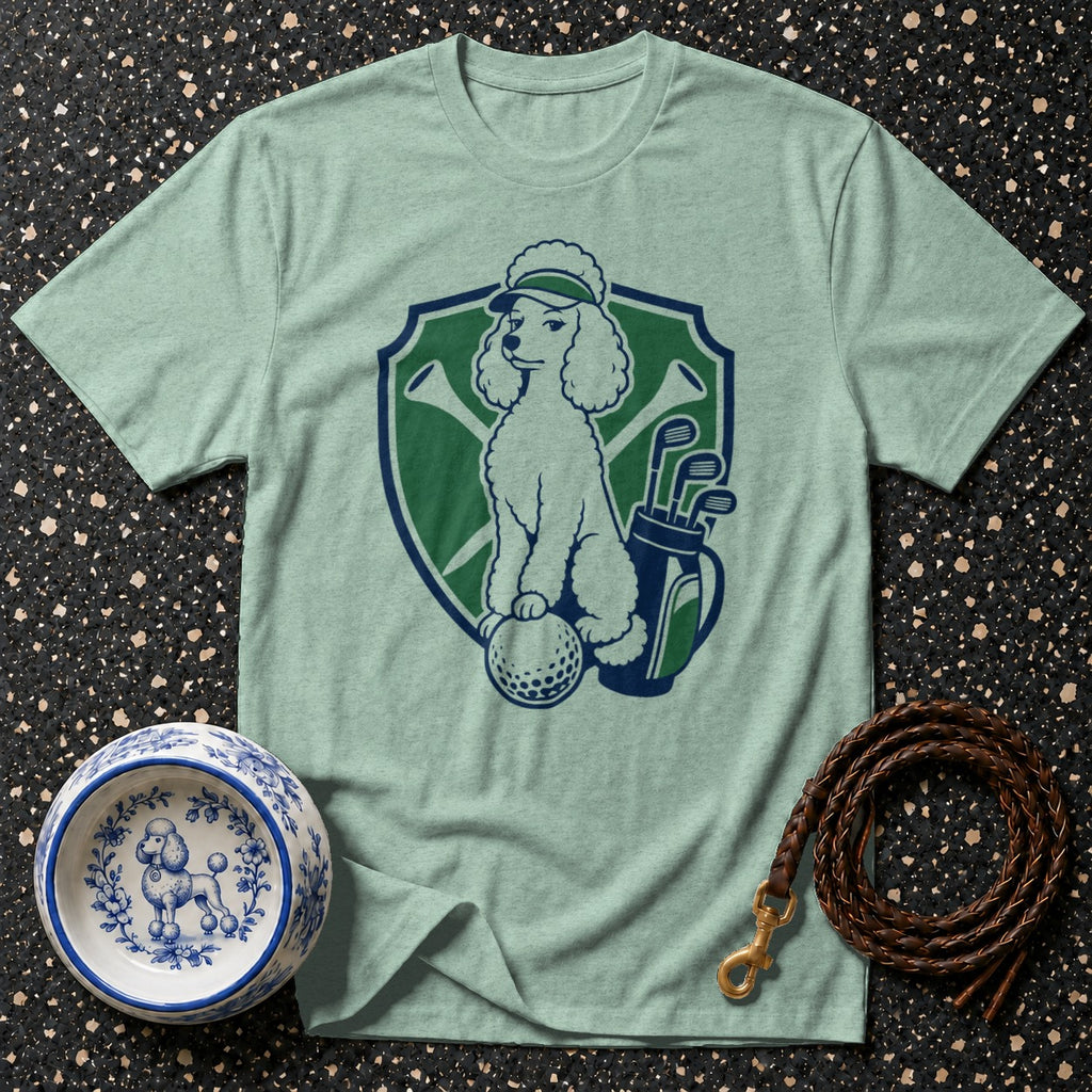 Light green t-shirt with a poodle on a golf ball, golf bag, and clubs emblem.