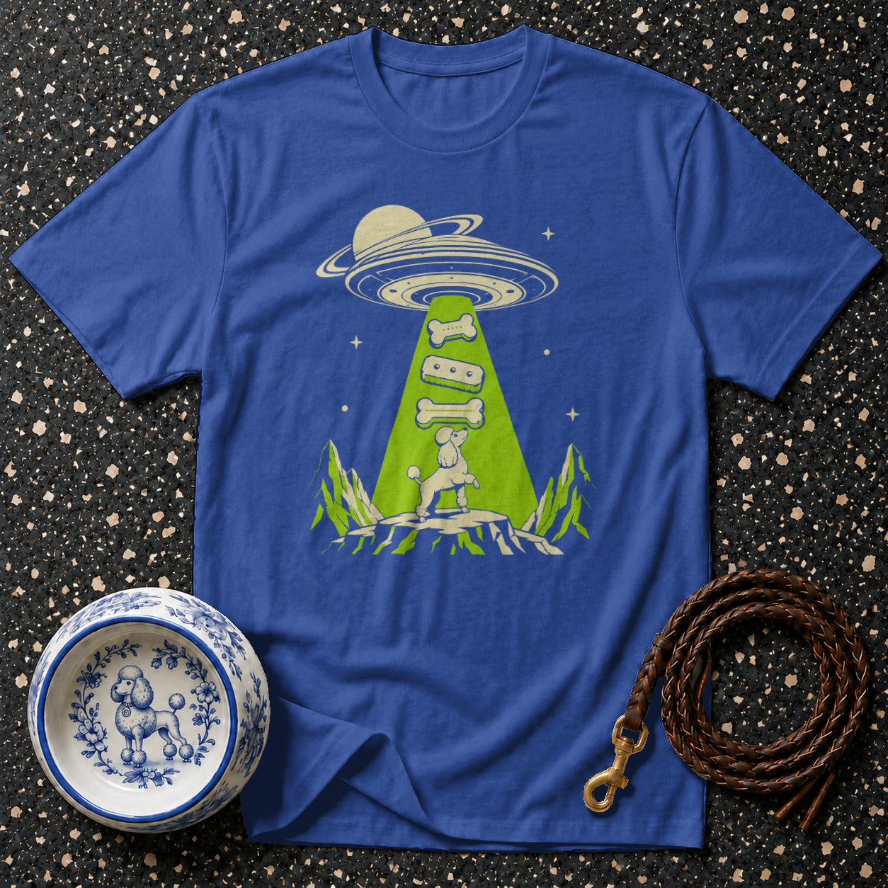 Blue t-shirt with poodle being abducted by a UFO with dog bones.