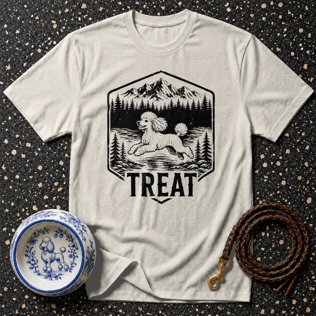 White t-shirt with a black graphic of a poodle running in a forest scene, text reads "TREAT".