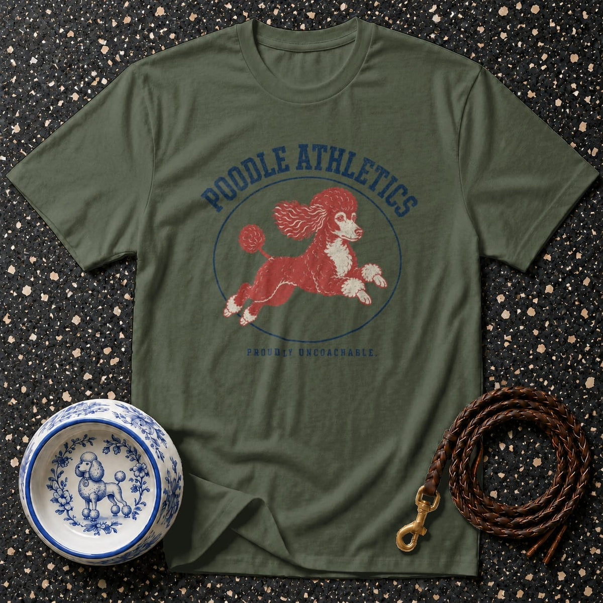 Green t-shirt with red poodle graphic and text "POODLE ATHLETICS PROUDLY UNCOACHABLE".