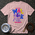 Pink t-shirt with a poodle graphic and "WE STARTED WALK SPELLING IT." text.
