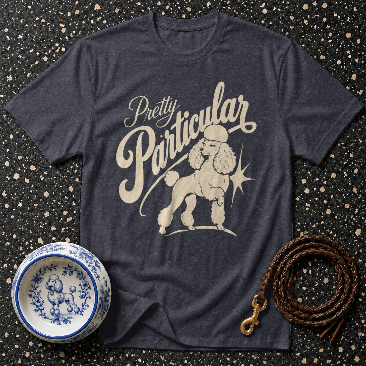 Dark grey t-shirt with "Pretty Particular" text and a poodle graphic.