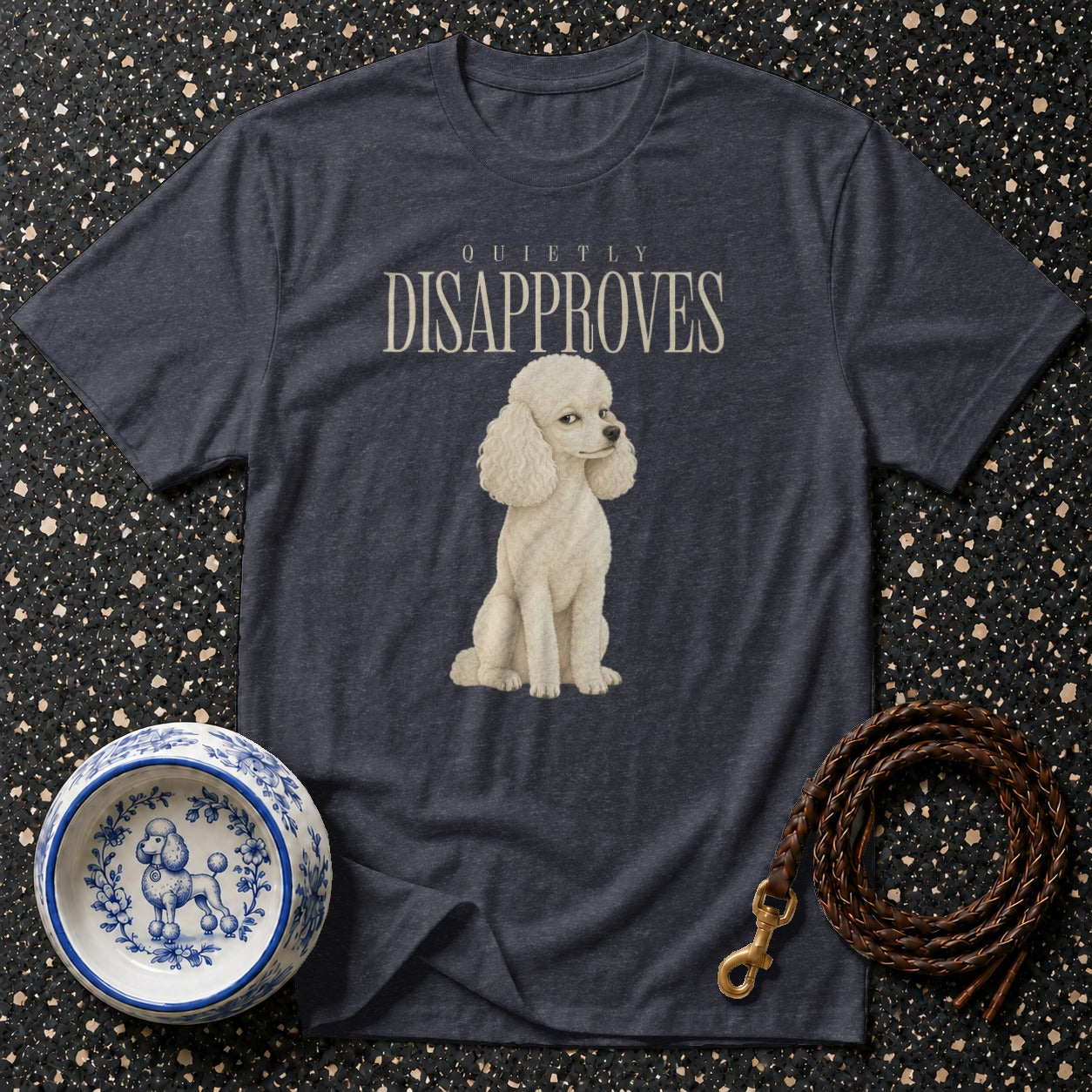 Dark t-shirt with white poodle and "Quietly Disapproves" text.