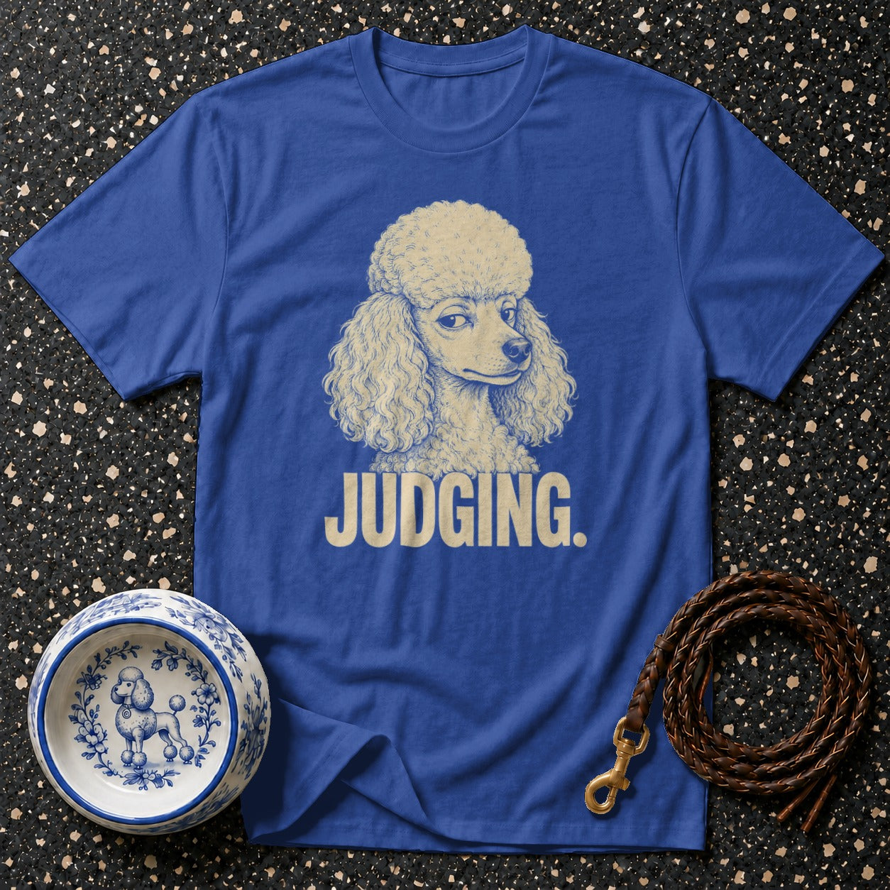 Blue t-shirt with poodle graphic and text "JUDGING."