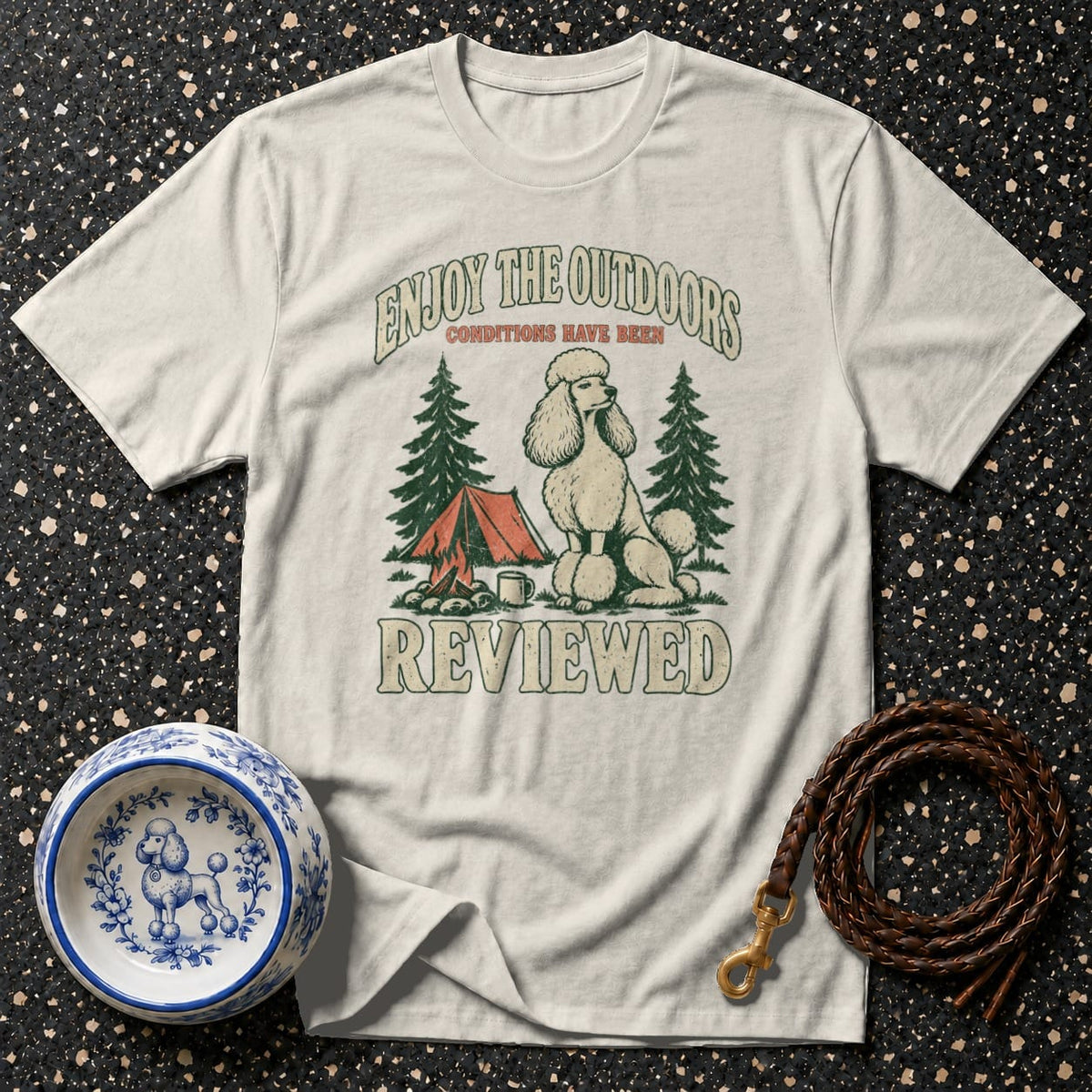 Cream t-shirt with poodle camping graphic and text "Enjoy the Outdoors Conditions Have Been Reviewed."